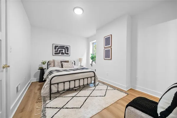 a bedroom with a bed and a couch