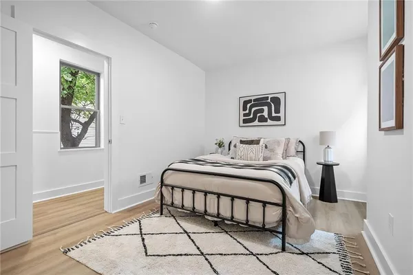 a bedroom with a bed and a window