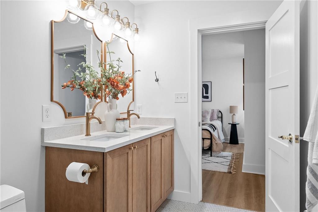 1431 Adams Street Pittsburgh, PA 15233 - Photo 21 of 42 a bathroom with a sink vanity granite and a mirror