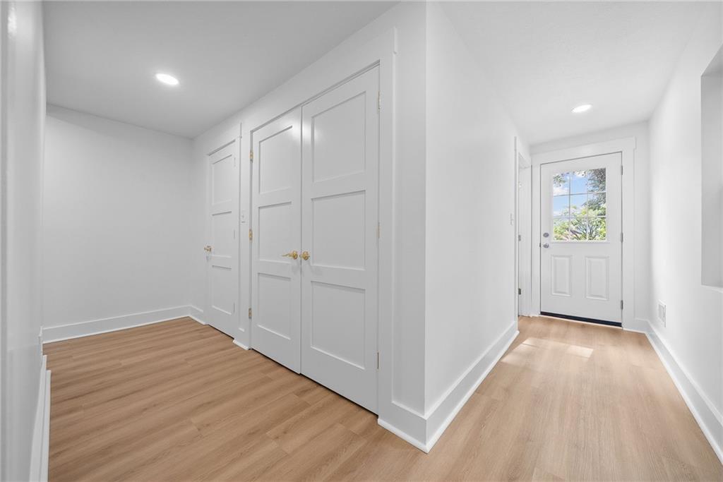 1431 Adams Street Pittsburgh, PA 15233 - Photo 22 of 42 wooden floor in an empty room with a window