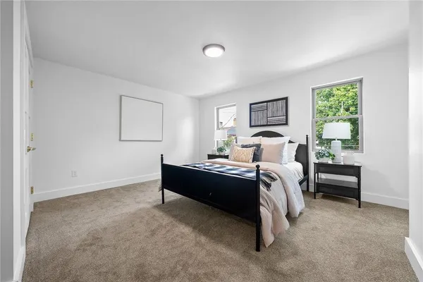 a bed room with a bed and a window