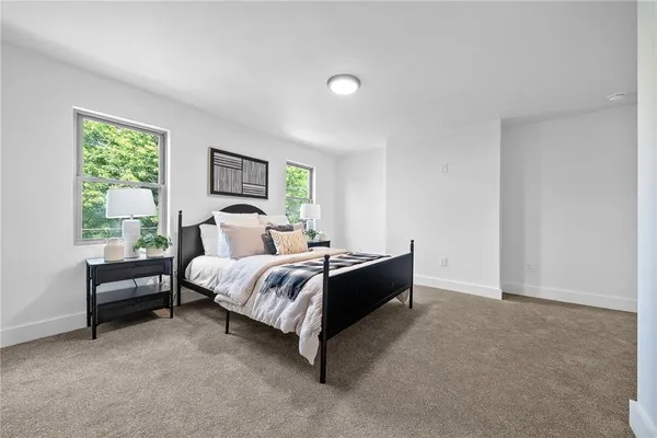 a bed room with a bed and a window