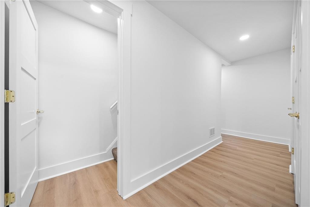 1431 Adams Street Pittsburgh, PA 15233 - Photo 28 of 42 a view of empty room with wooden floor