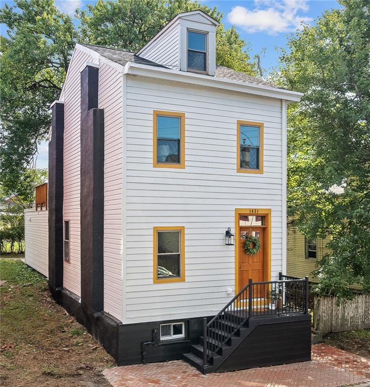 1431 Adams Street Pittsburgh, PA 15233 - Photo 3 of 42 a view of a house with a yard and furniture