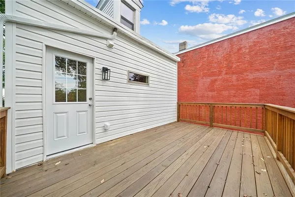 a view of deck with wooden floor and fence