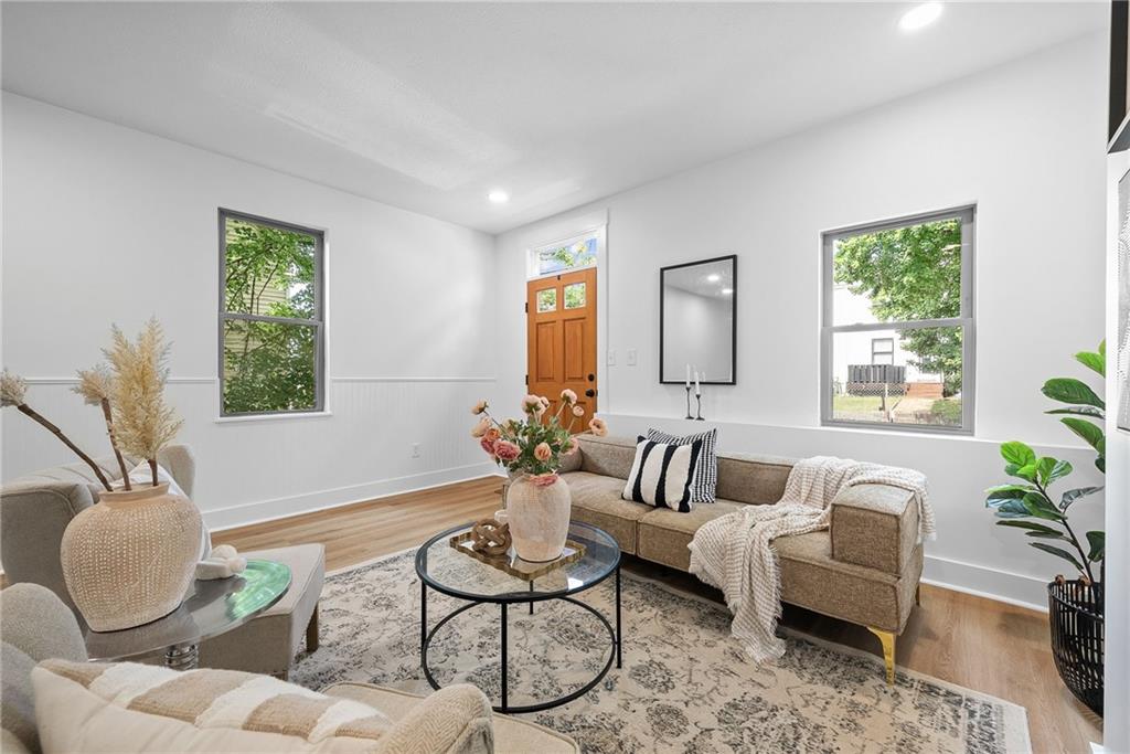 1431 Adams Street Pittsburgh, PA 15233 - Photo 5 of 42 a living room with furniture and a potted plant