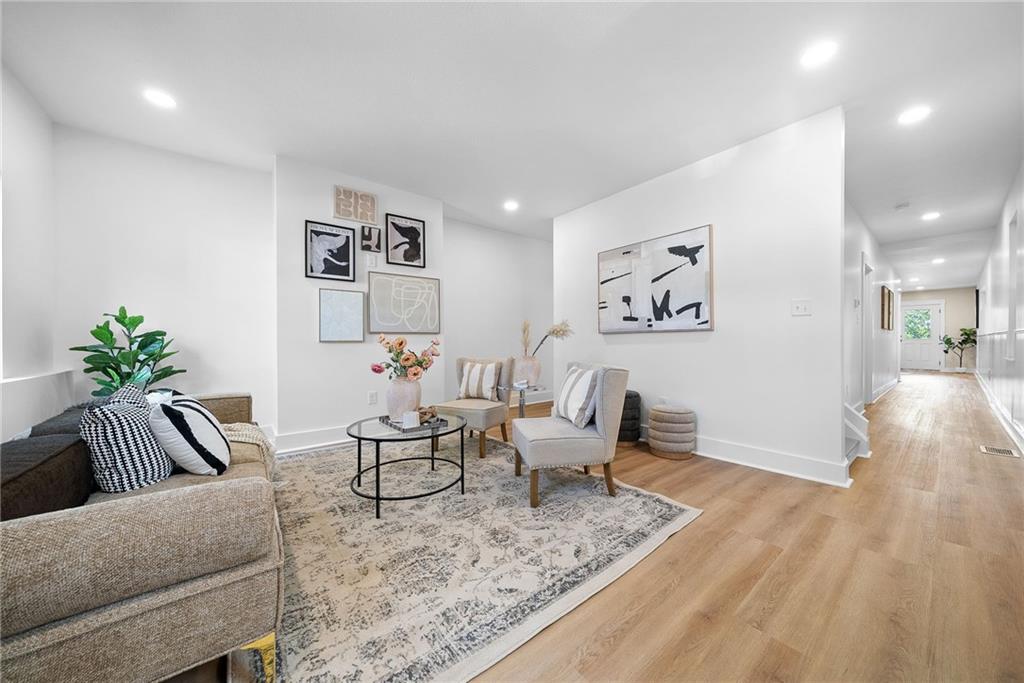 1431 Adams Street Pittsburgh, PA 15233 - Photo 8 of 42 a living room with furniture and wooden floor