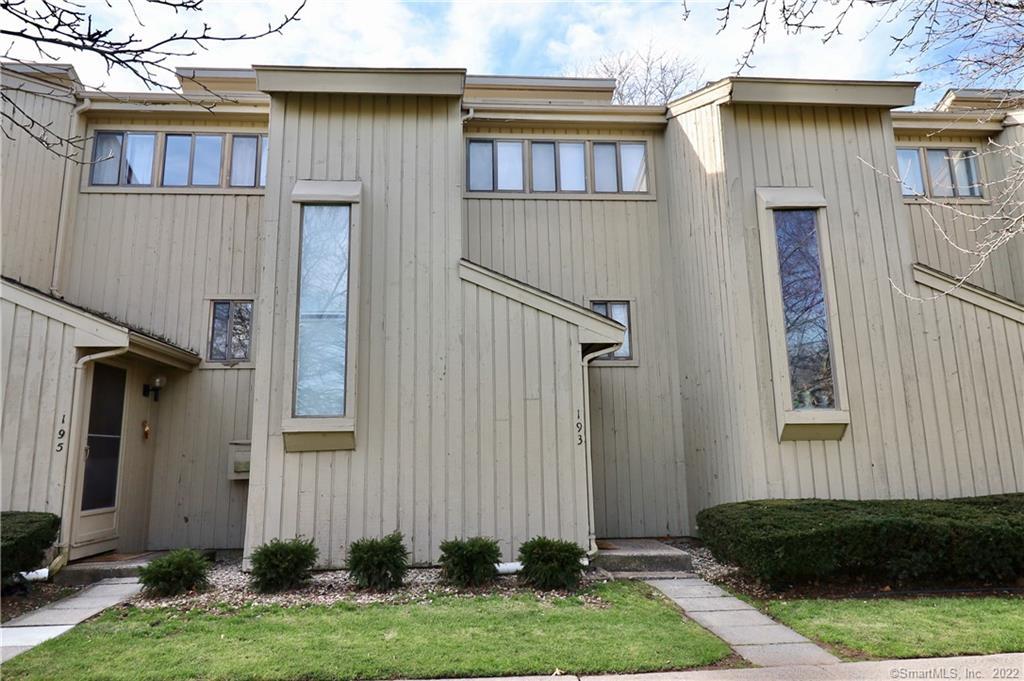 193 Spring Street, Unit 193 Wethersfield, CT 06109 - Photo 1 of 1 a front view of a house with a yard