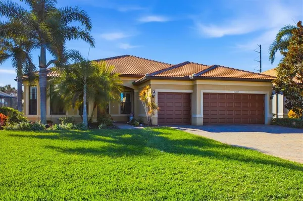 a view of a house with a yard