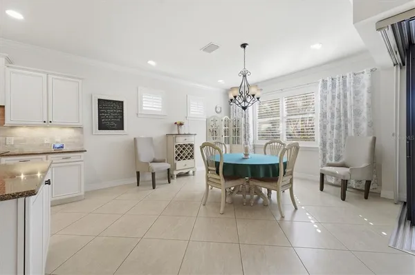 a spacious bathroom with a granite countertop sink a mirror and a shower