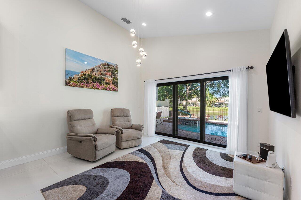 23419 Mirabella Circle South Boca Raton, FL 33433 - Photo 20 of 57 a living room with furniture and a flat screen tv