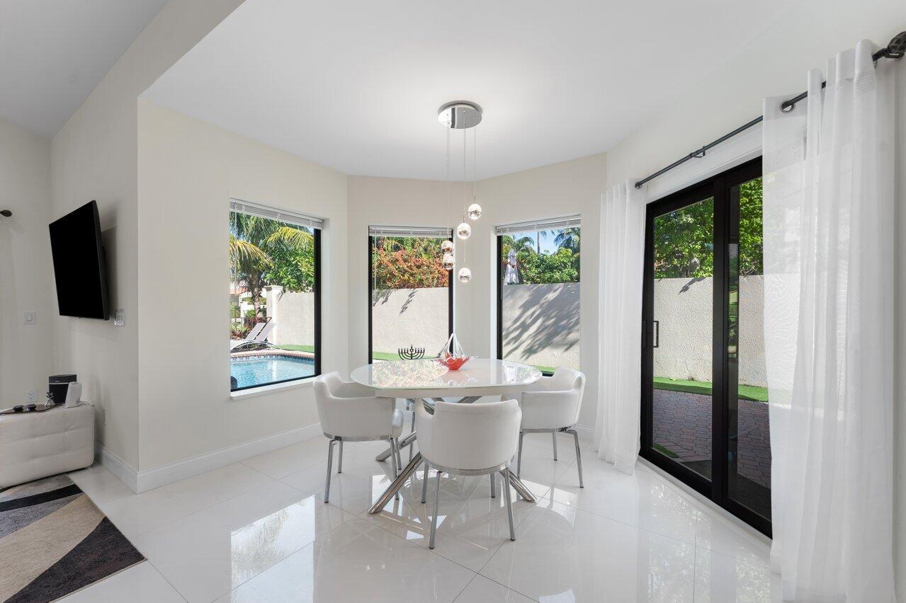 23419 Mirabella Circle South Boca Raton, FL 33433 - Photo 22 of 57 a view of a dining room with furniture window and outside view