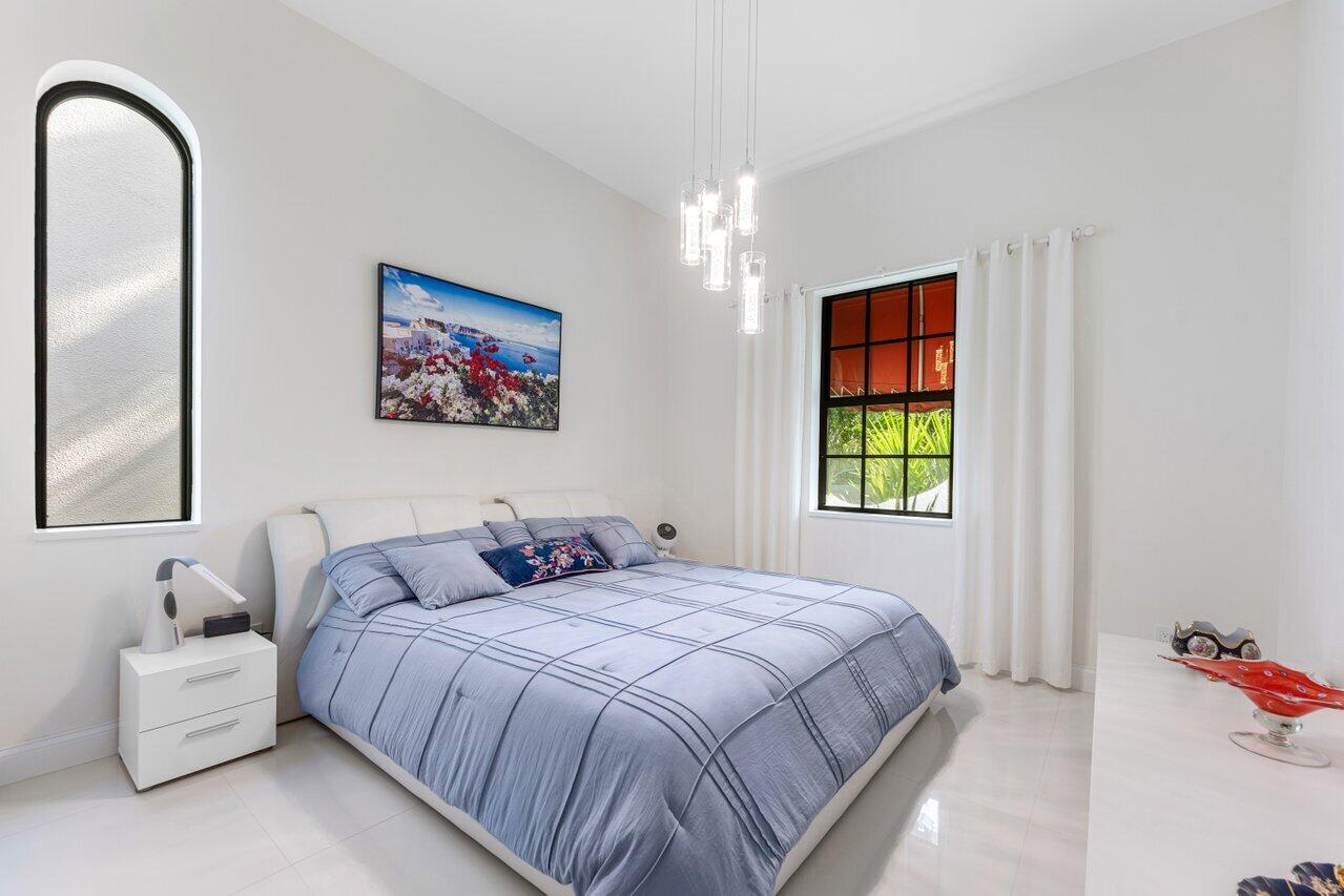 23419 Mirabella Circle South Boca Raton, FL 33433 - Photo 23 of 57 a bedroom with bed and a window