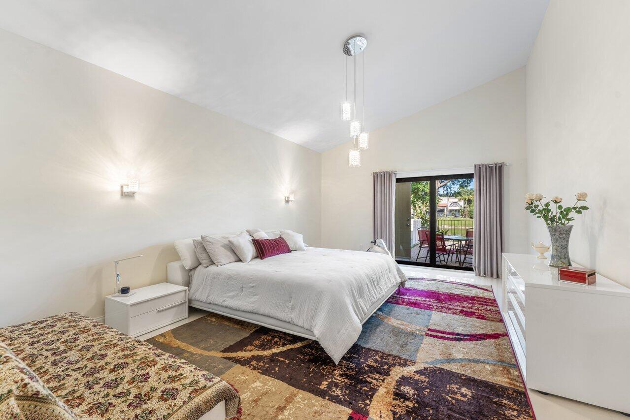 23419 Mirabella Circle South Boca Raton, FL 33433 - Photo 34 of 57 a bedroom with a bed and a window