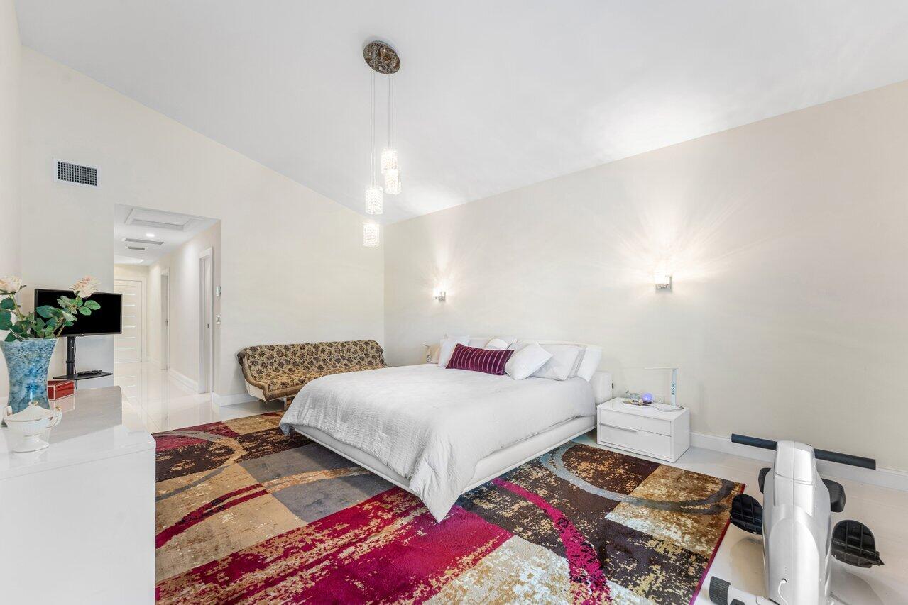 23419 Mirabella Circle South Boca Raton, FL 33433 - Photo 35 of 57 a bedroom with a bed and window