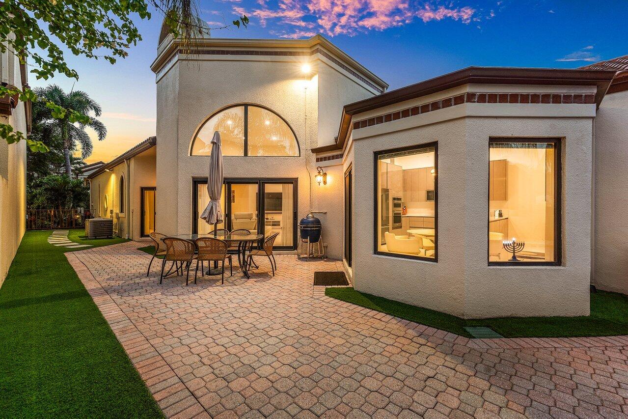 23419 Mirabella Circle South Boca Raton, FL 33433 - Photo 49 of 57 a front view of a house with outdoor seating