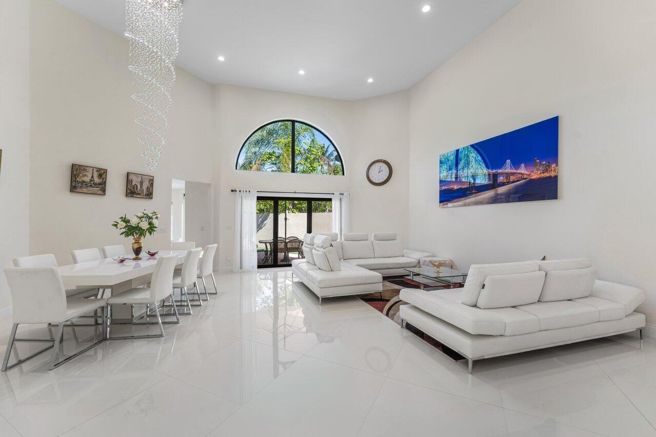 23419 Mirabella Circle South Boca Raton, FL 33433 - Photo 5 of 57 a living room with furniture and a large window