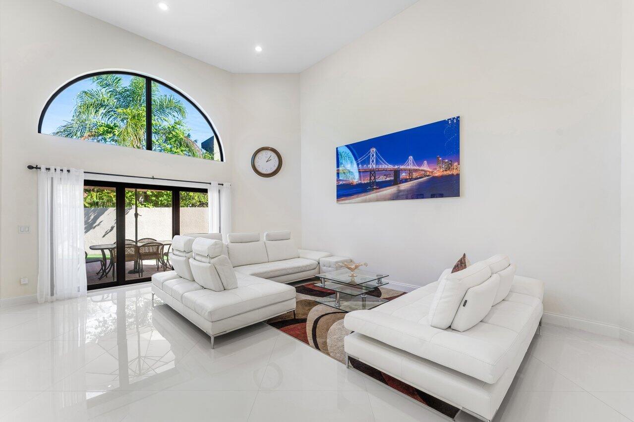 23419 Mirabella Circle South Boca Raton, FL 33433 - Photo 10 of 57 a living room with furniture garden view and a large window