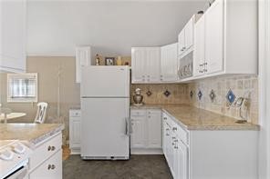 5025 Lake Road, Unit 8 Williamson, NY 14589 - Photo 7 of 22 the bright and open kitchen