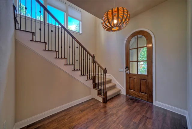 a view of entryway with wooden floor and a window