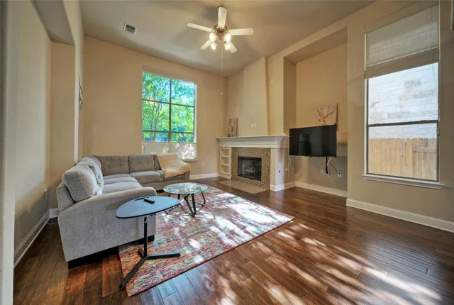 a living room with furniture fireplace and window