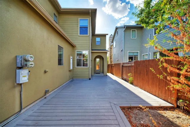 a view of a house with pool and sitting area