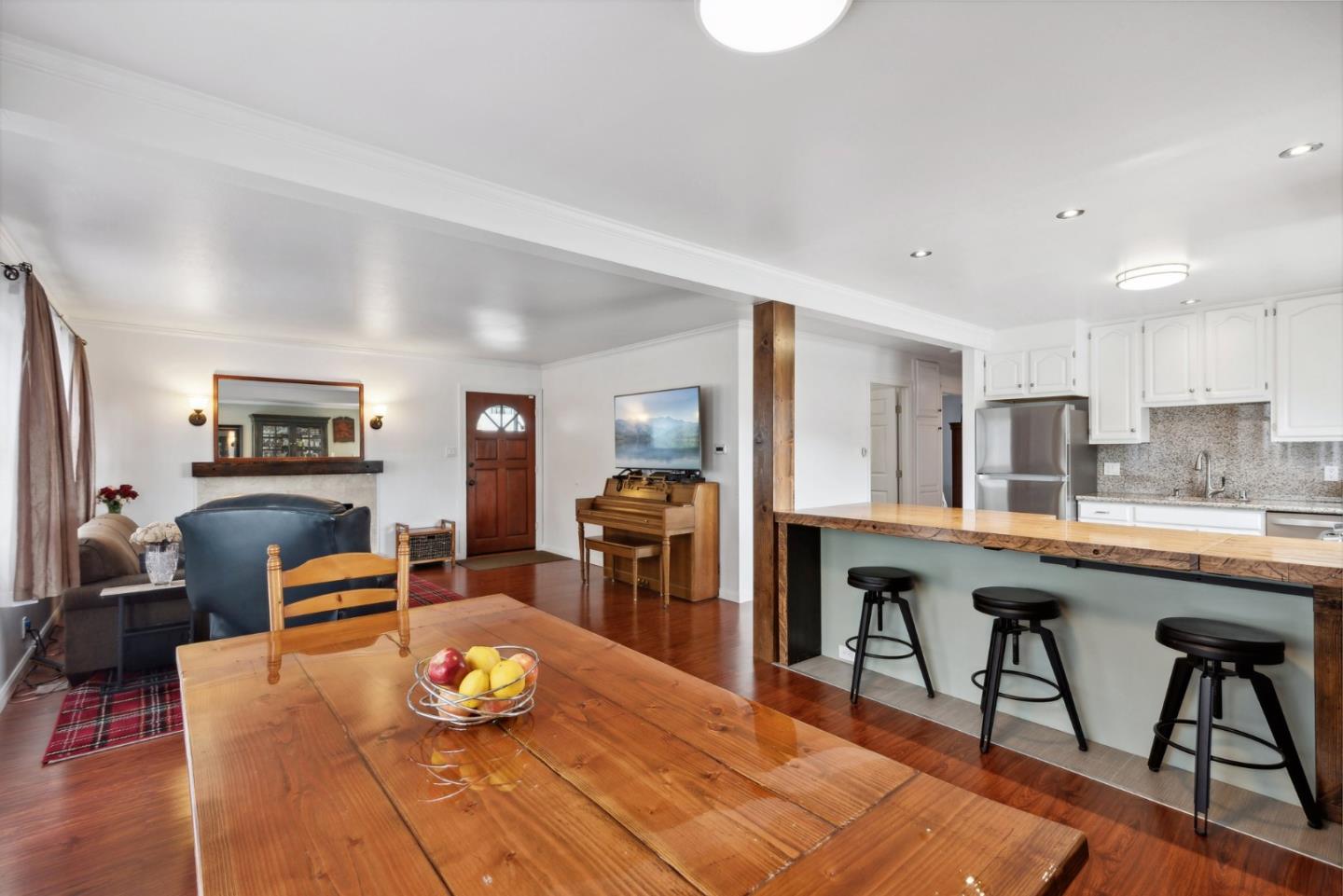 965 Monte Verde Drive Pacifica, CA 94044 - Photo 11 of 34 a living room with furniture and a wooden floor