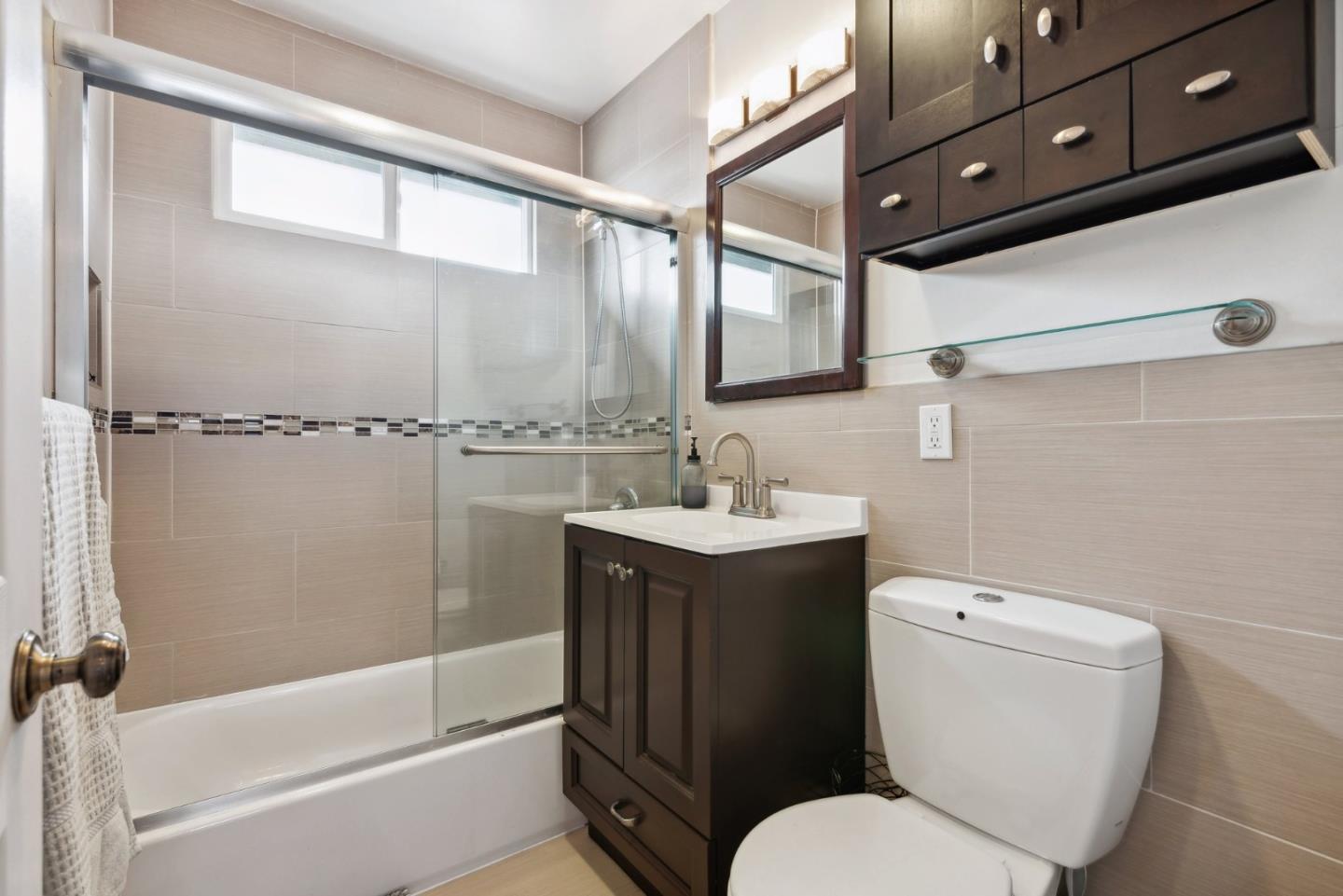 965 Monte Verde Drive Pacifica, CA 94044 - Photo 15 of 34 a bathroom with a sink toilet and shower