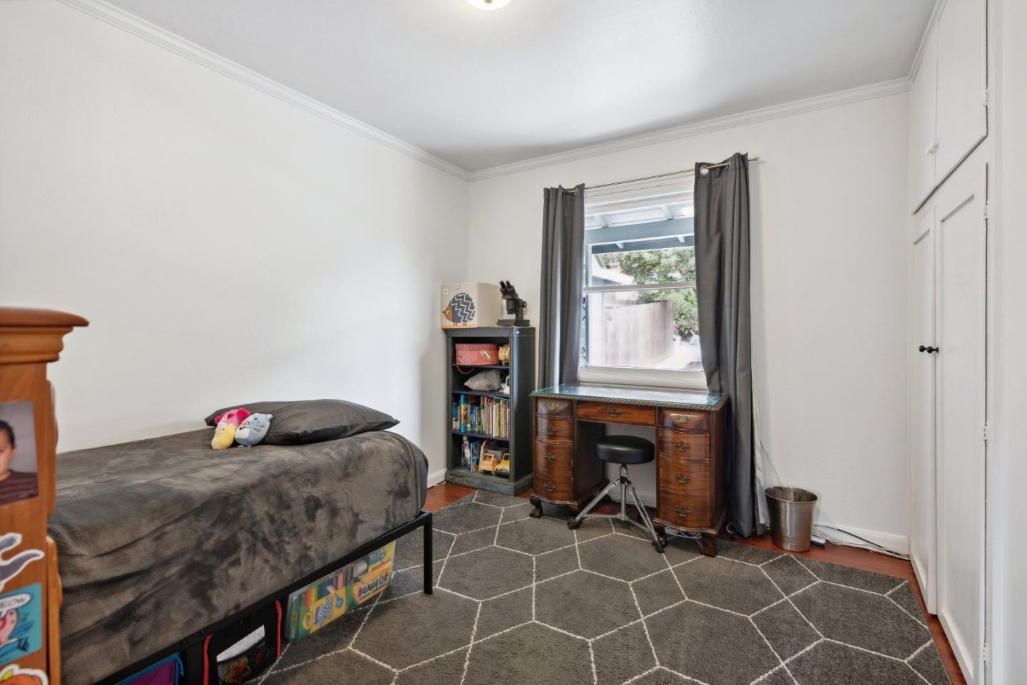 965 Monte Verde Drive Pacifica, CA 94044 - Photo 16 of 34 a bedroom with a bed and a window in it