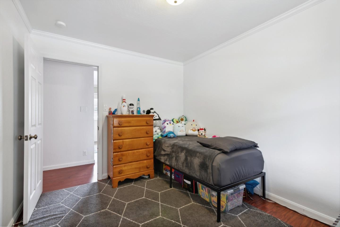 965 Monte Verde Drive Pacifica, CA 94044 - Photo 17 of 34 a living room with a bed and furniture