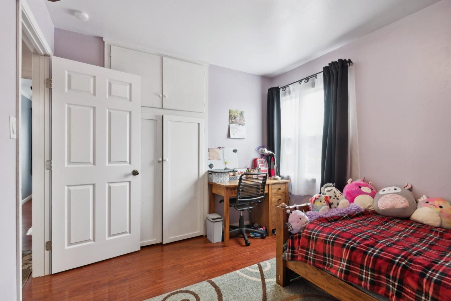 965 Monte Verde Drive Pacifica, CA 94044 - Photo 19 of 34 a bedroom with a bed and a window