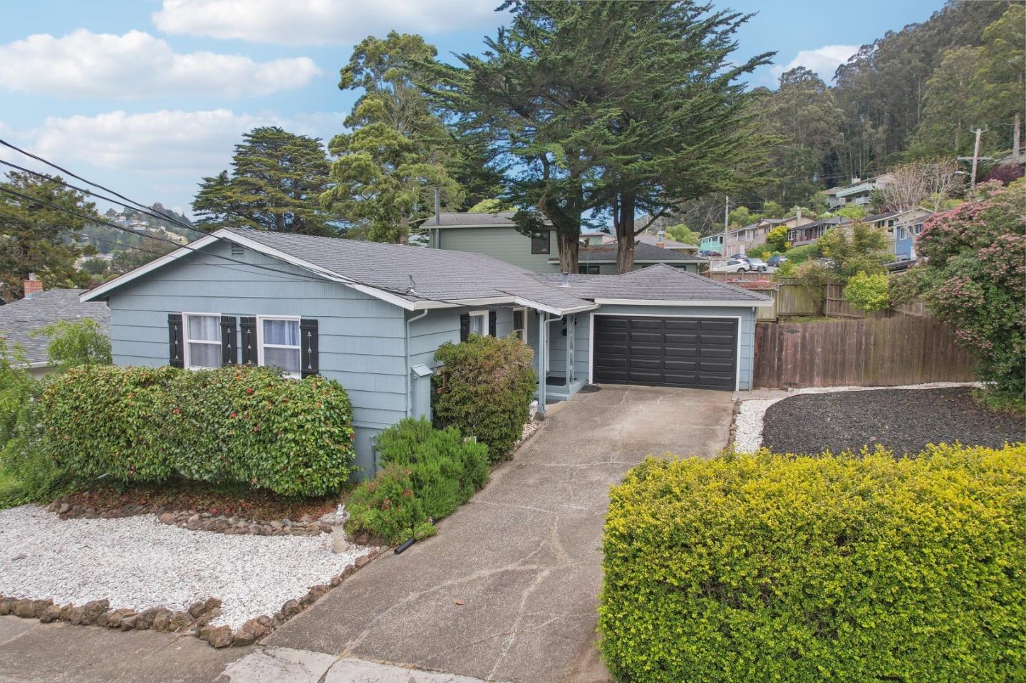 965 Monte Verde Drive Pacifica, CA 94044 - Photo 2 of 34 a front view of a house with garden