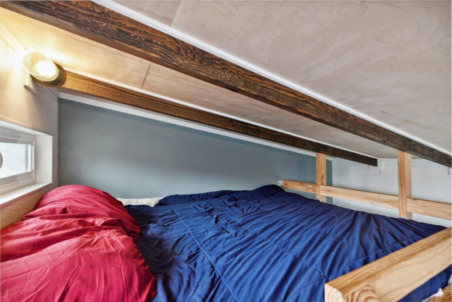 965 Monte Verde Drive Pacifica, CA 94044 - Photo 27 of 34 a view of staircase with wooden floor and book shelf