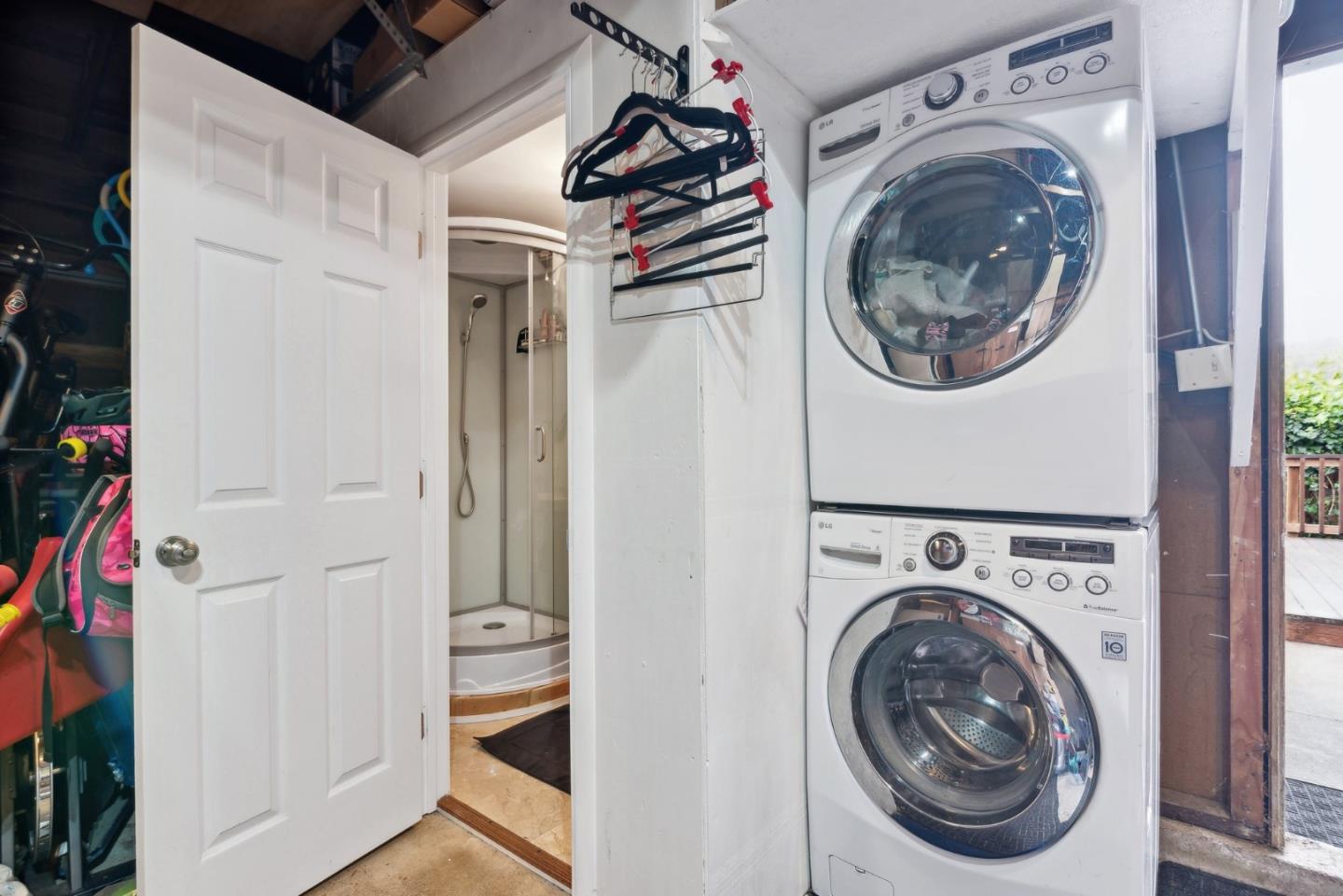 965 Monte Verde Drive Pacifica, CA 94044 - Photo 31 of 34 a view of a storage and utility room with washer and dryer