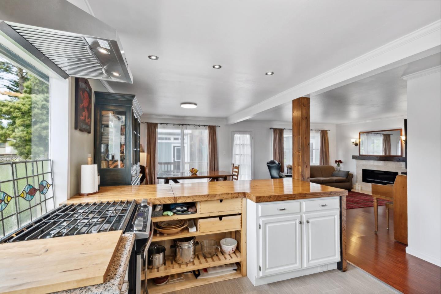 965 Monte Verde Drive Pacifica, CA 94044 - Photo 7 of 34 a large white kitchen with stainless steel appliances granite countertop a stove and a refrigerator