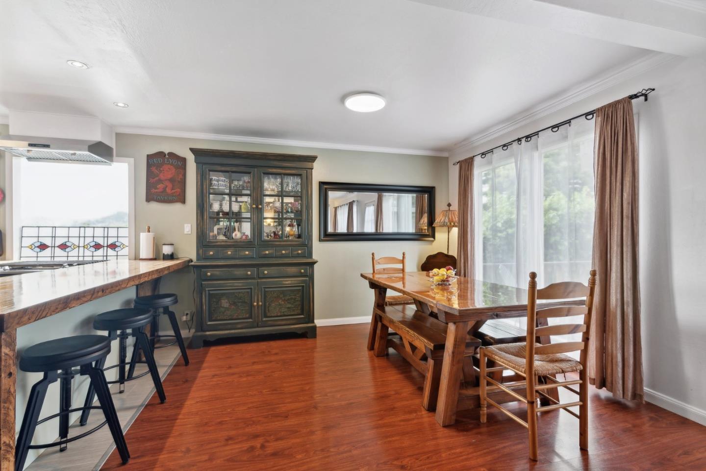 965 Monte Verde Drive Pacifica, CA 94044 - Photo 9 of 34 a view of a dining room with furniture and wooden floor
