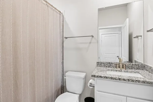 a bedroom with furniture and a baby crib