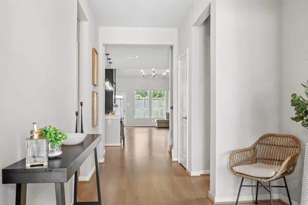 a view of a dining room that has a table and chairs in it