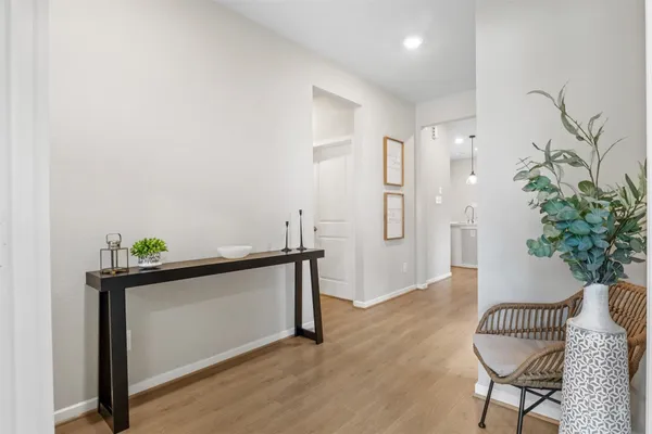 a large kitchen with kitchen island a large counter space a sink stainless steel appliances and cabinets