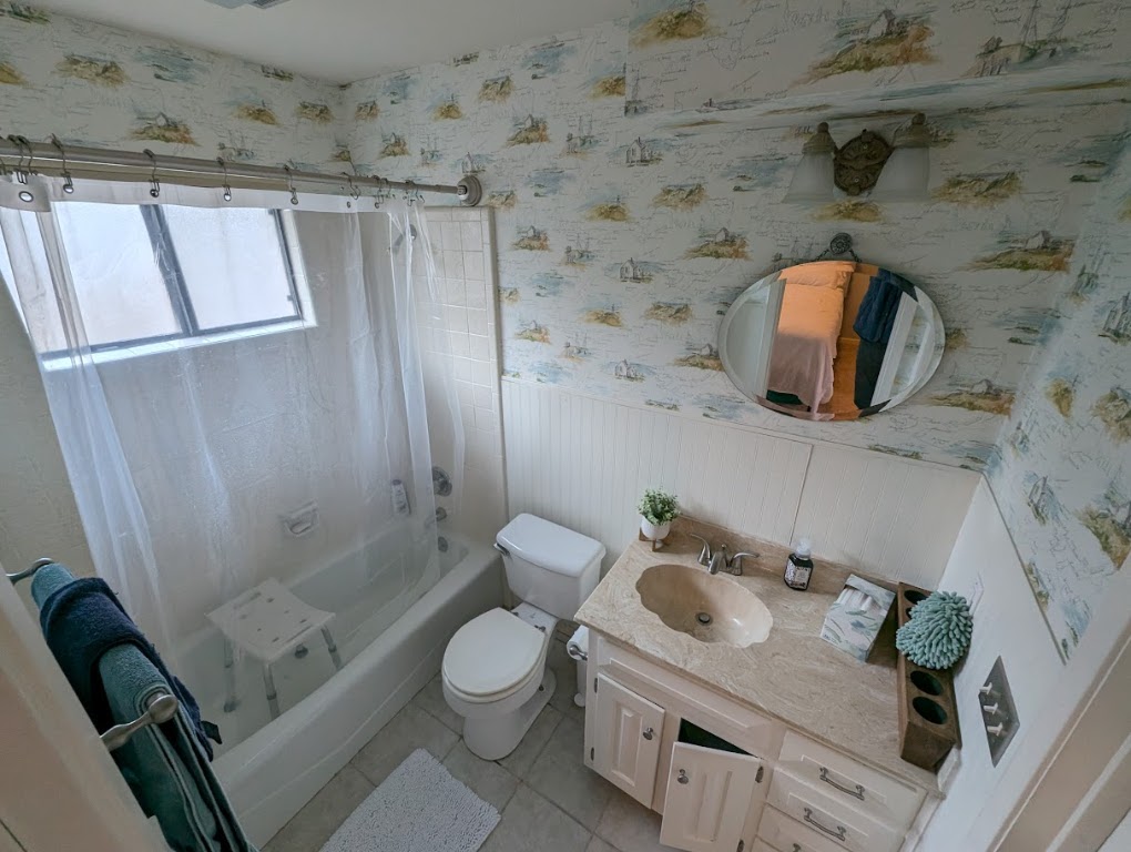 208 Crescent Bluff Lakeway, TX 78734 - Photo 12 of 21 a bathroom with a sink a toilet and shower