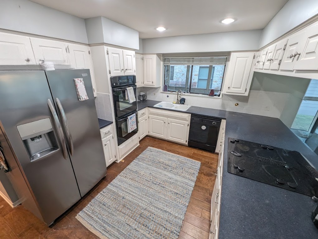 208 Crescent Bluff Lakeway, TX 78734 - Photo 14 of 21 a large kitchen with stainless steel appliances refrigerator and microwave