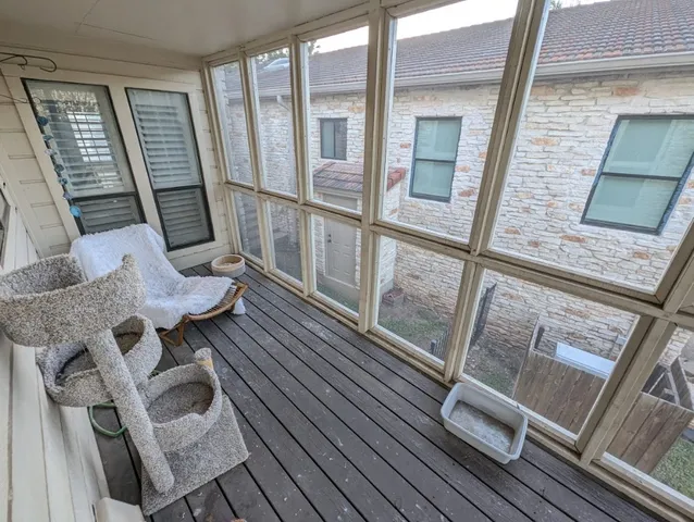 a view of living room with furniture and a floor to ceiling window