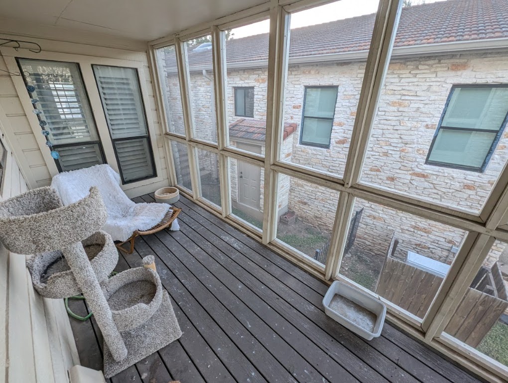 208 Crescent Bluff Lakeway, TX 78734 - Photo 17 of 21 a view of living room with furniture and a floor to ceiling window