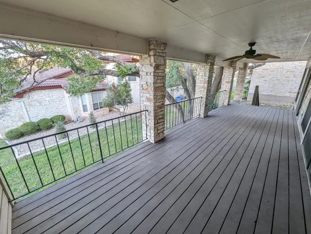a view of balcony with wooden floor