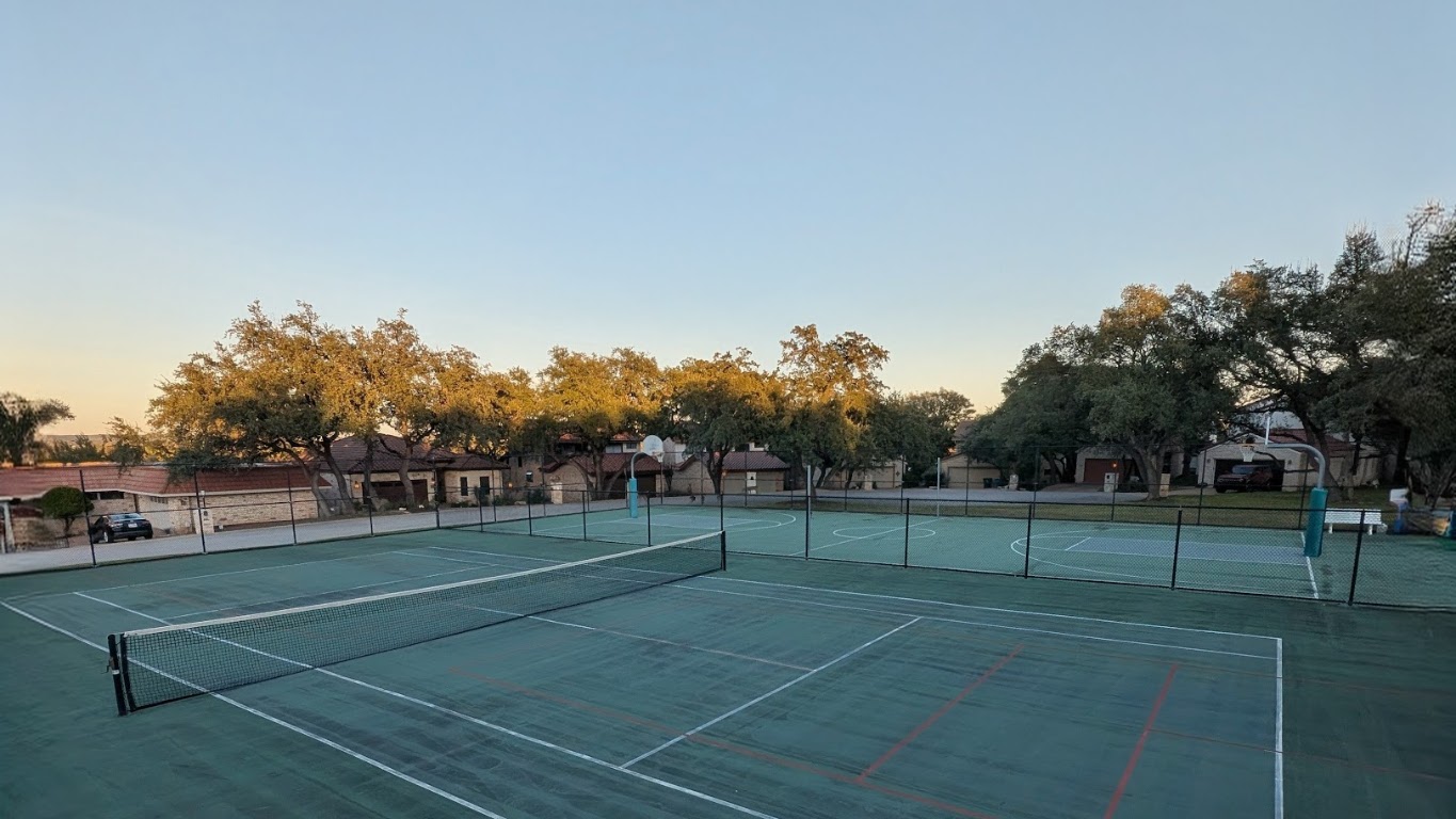208 Crescent Bluff Lakeway, TX 78734 - Photo 20 of 21 a view of an outdoor space and tennis court