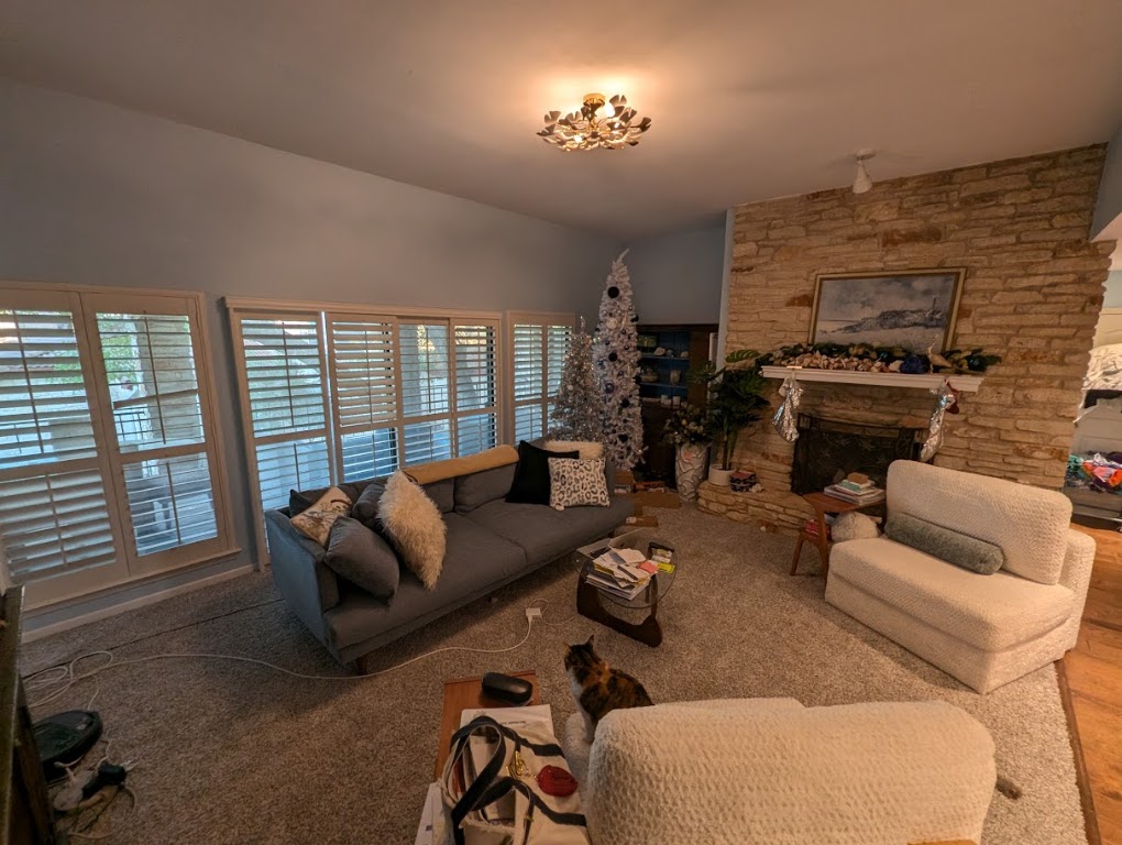 208 Crescent Bluff Lakeway, TX 78734 - Photo 5 of 21 a living room with furniture fireplace and a flat screen tv