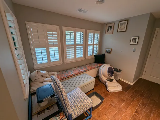 a living room with furniture and a window