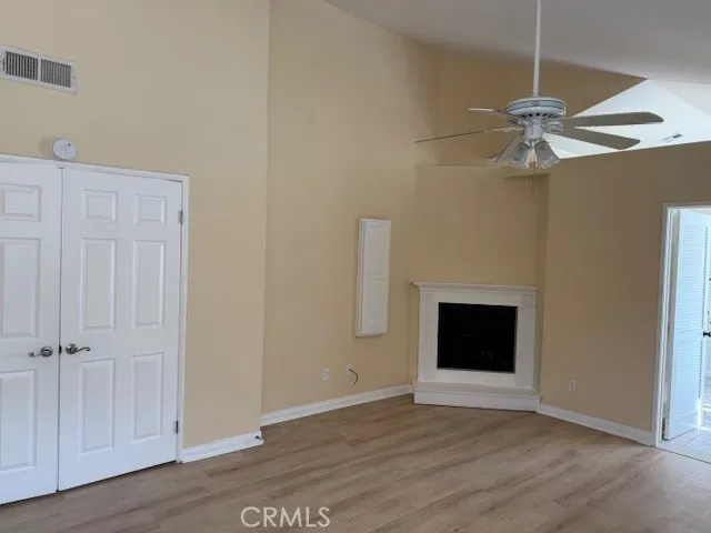 a view of a livingroom with a ceiling fan and window