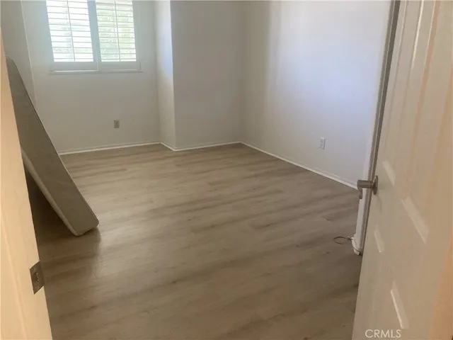 a view of a house with a yard and roof