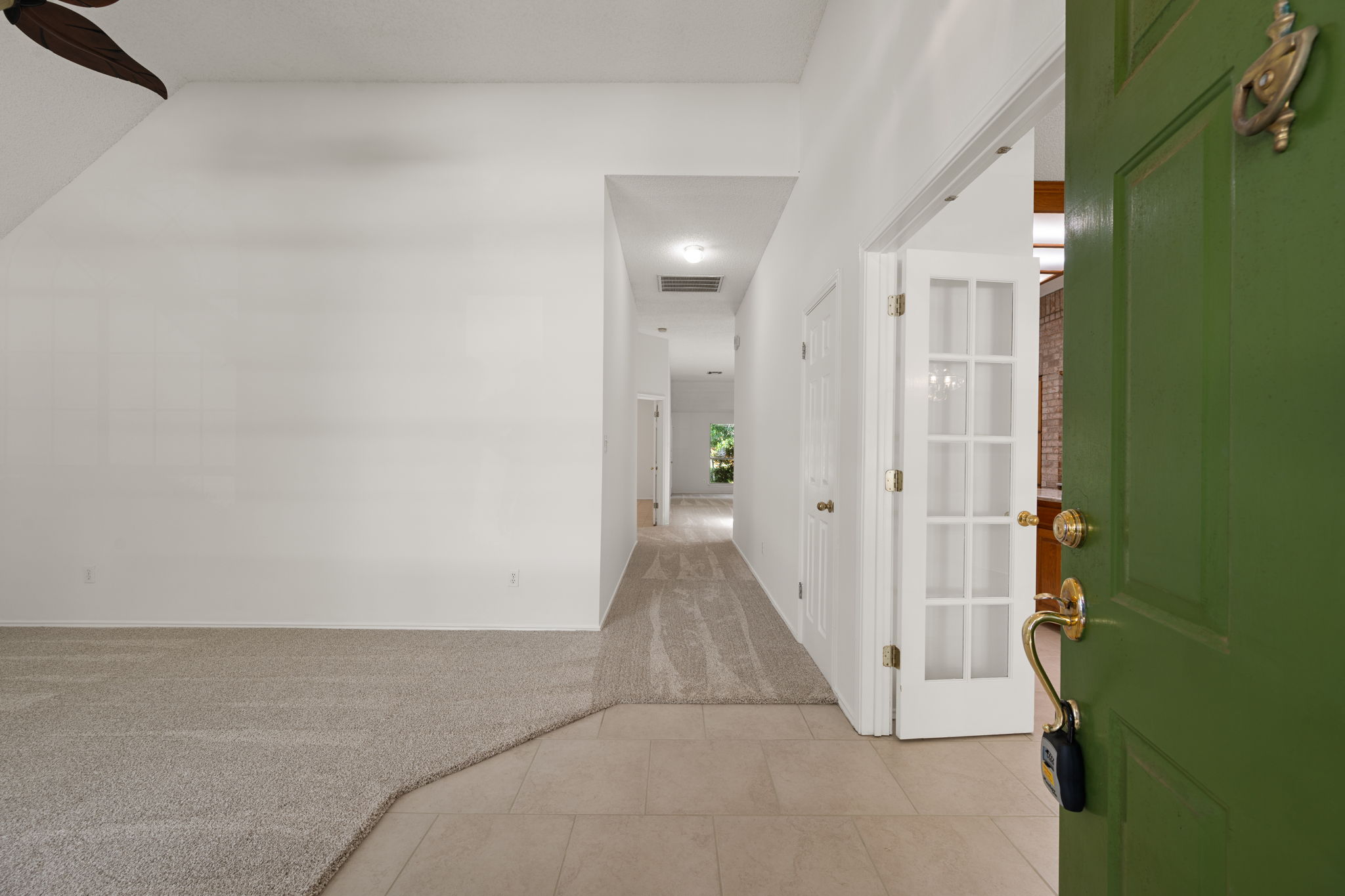 707 Ridge View Drive Leander, TX 78641 - Photo 6 of 40 a view of a hallway with wooden floor and a bathroom